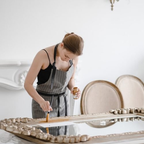 female-artisan-hands-working-big-wooden-picture-frame_209729-128