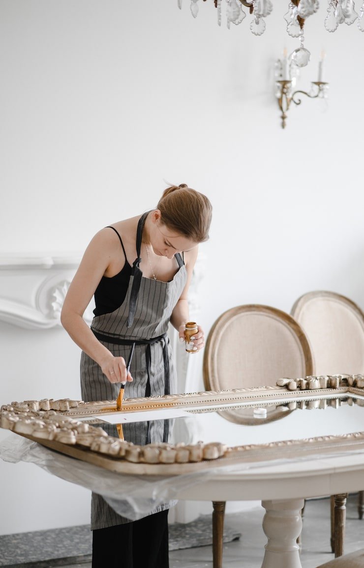 female-artisan-hands-working-big-wooden-picture-frame_209729-128